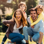 Family playing in a field on a sunny day